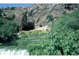 Caesarea Philippi, Baniyas - Temple of Pan with the River Baniyas, one of sources of Jordan.